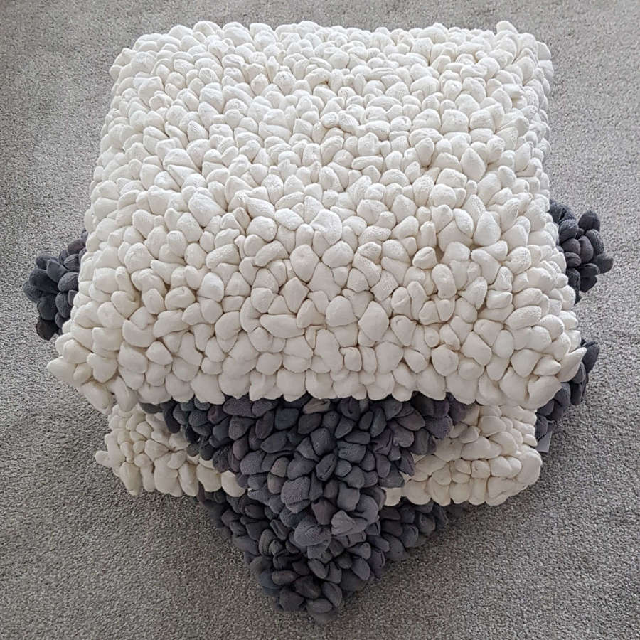 White pebble design cushion