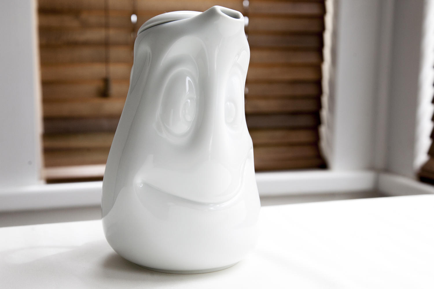 White porcelain smiling tea/coffee pot