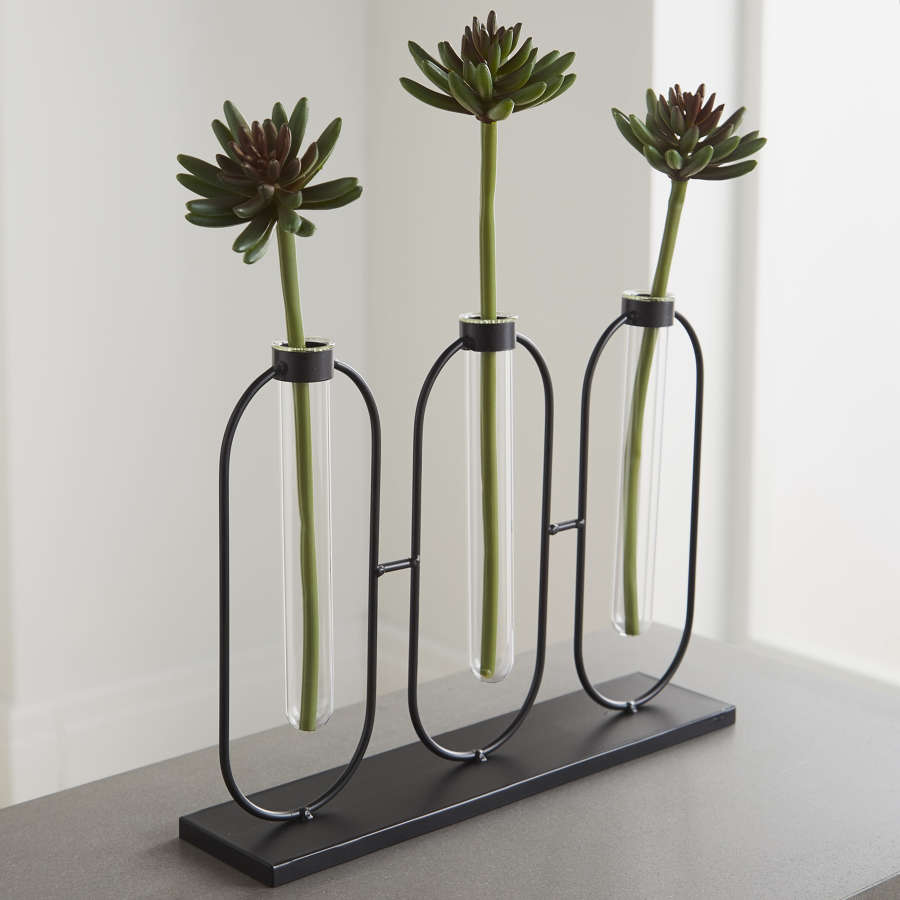 3 glass test tube bud vases on black metal stand
