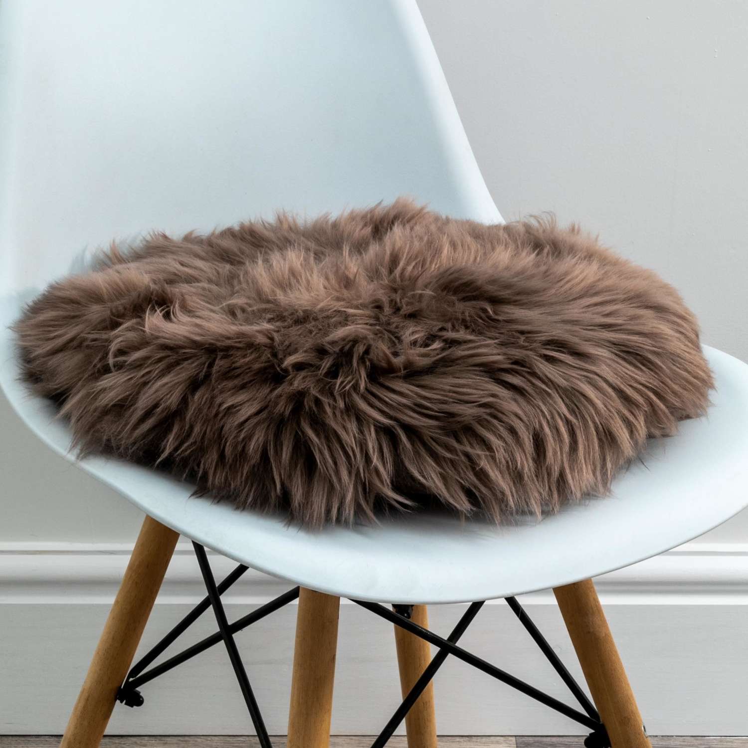 Taupe round sheepskin chair pad